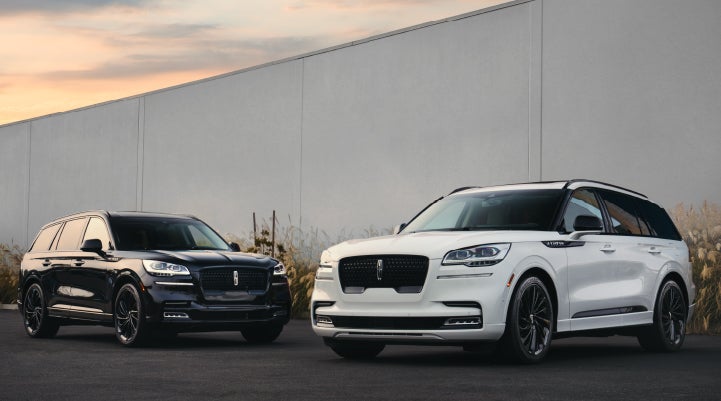 Two Lincoln Aviator® SUVs are shown with the available Jet Appearance Package | Gray-Daniels Lincoln in Brandon MS