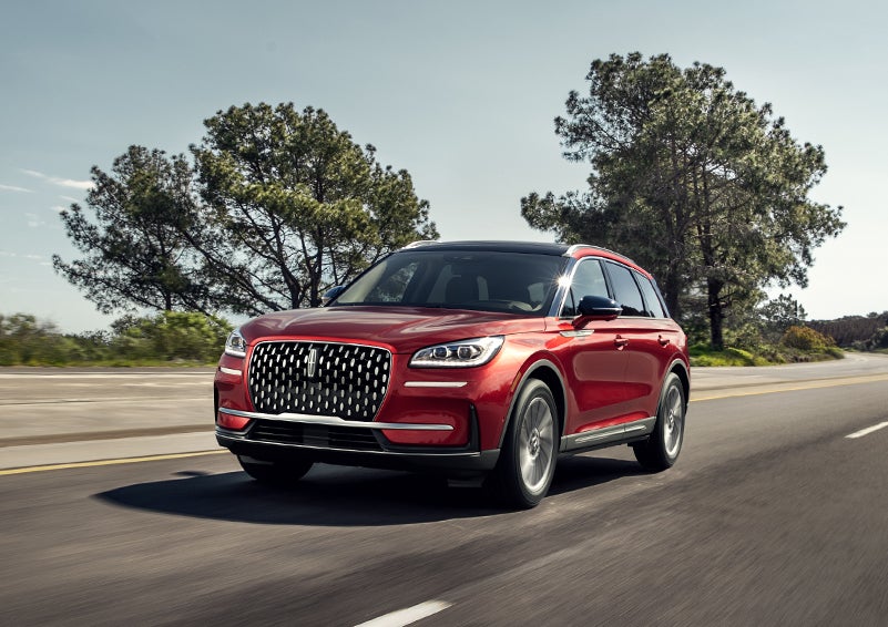 A 2024 Lincoln Corsair® SUV is shown being driven on a country road. | Gray-Daniels Lincoln in Brandon MS