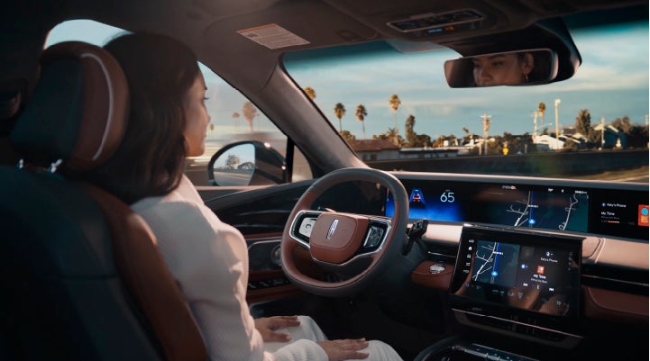 A person is shown driving hands-free on the highway with available Lincoln BlueCruise technology. | Gray-Daniels Lincoln in Brandon MS