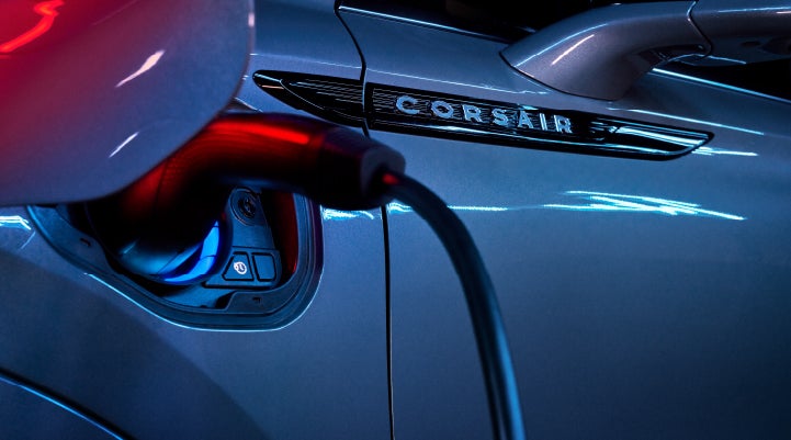 A charger plugged into the charging port of a 2024 Lincoln Corsair® Plug-in Hybrid model. | Gray-Daniels Lincoln in Brandon MS