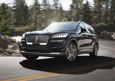 A Lincoln Aviator® SUV is being driven on a winding mountain road | Gray-Daniels Lincoln in Brandon MS