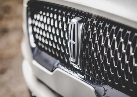 The grille of the 2024 Lincoln Aviator® Reserve model with an eye-catching repeated field of Lincoln Star logo shapes | Gray-Daniels Lincoln in Brandon MS