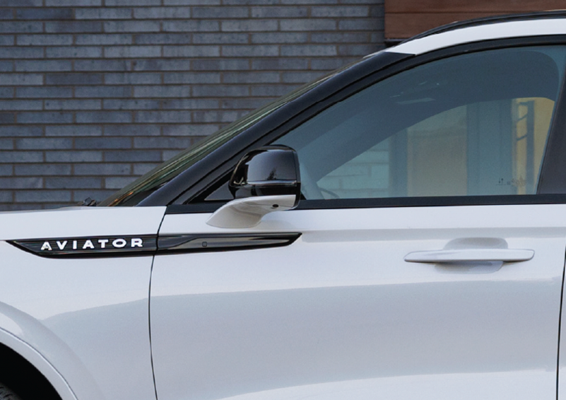The driver’s door of a white 2025 Lincoln Aviator® SUV is showcased. | Gray-Daniels Lincoln in Brandon MS