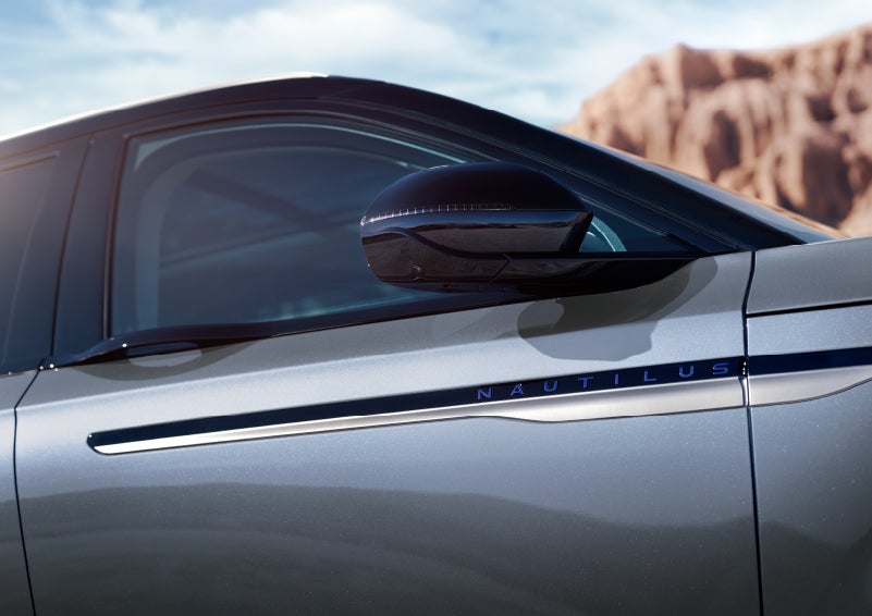 Blue lettering on the side of the vehicle that reads nautilus indicates the available hybrid powertrain. | Gray-Daniels Lincoln in Brandon MS