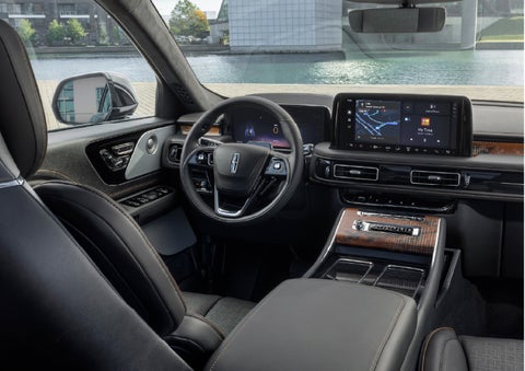 The interior of the 2026 Lincoln Aviator® SUV is shown parked with a view of a harbor through the windshield. | Gray-Daniels Lincoln in Brandon MS