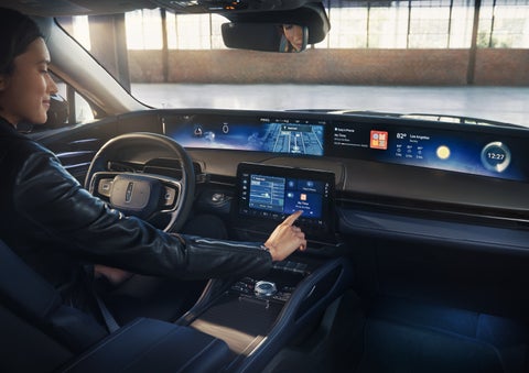 The driver of a 2026 Lincoln Nautilus® SUV interacts with the center touchscreen. | Gray-Daniels Lincoln in Brandon MS