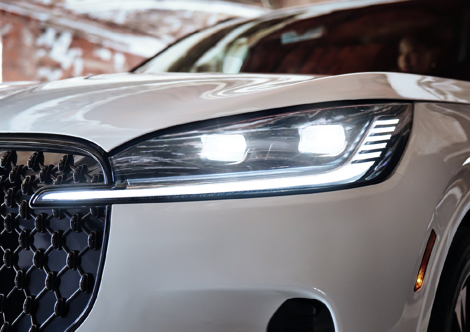 A close-up of a headlamp on the 2027 Lincoln Aviator® SUV is shown. | Gray-Daniels Lincoln in Brandon MS