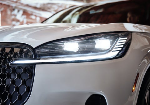 A close-up of a headlamp on the 2027 Lincoln Aviator® SUV is shown. | Gray-Daniels Lincoln in Brandon MS