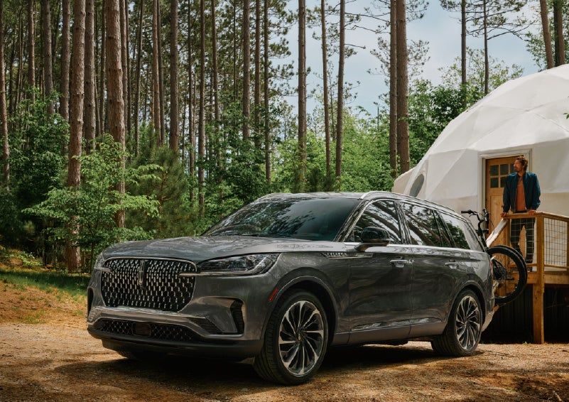 A 2027 Lincoln Aviator® is parked next to a high end glamping site. | Gray-Daniels Lincoln in Brandon MS
