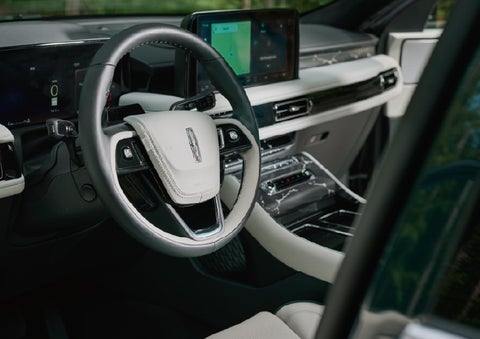 The leather-trimmed steering wheel of a 2027 Lincoln Aviator® Black Label™ SUV. | Gray-Daniels Lincoln in Brandon MS