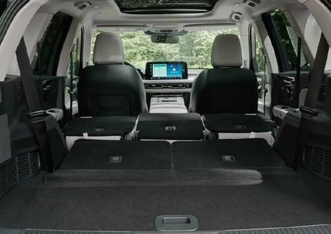 A rear to front view of the interior of a 2027 Lincoln Aviator® Black Label™ SUV shows the third and second rows folded flat | Gray-Daniels Lincoln in Brandon MS
